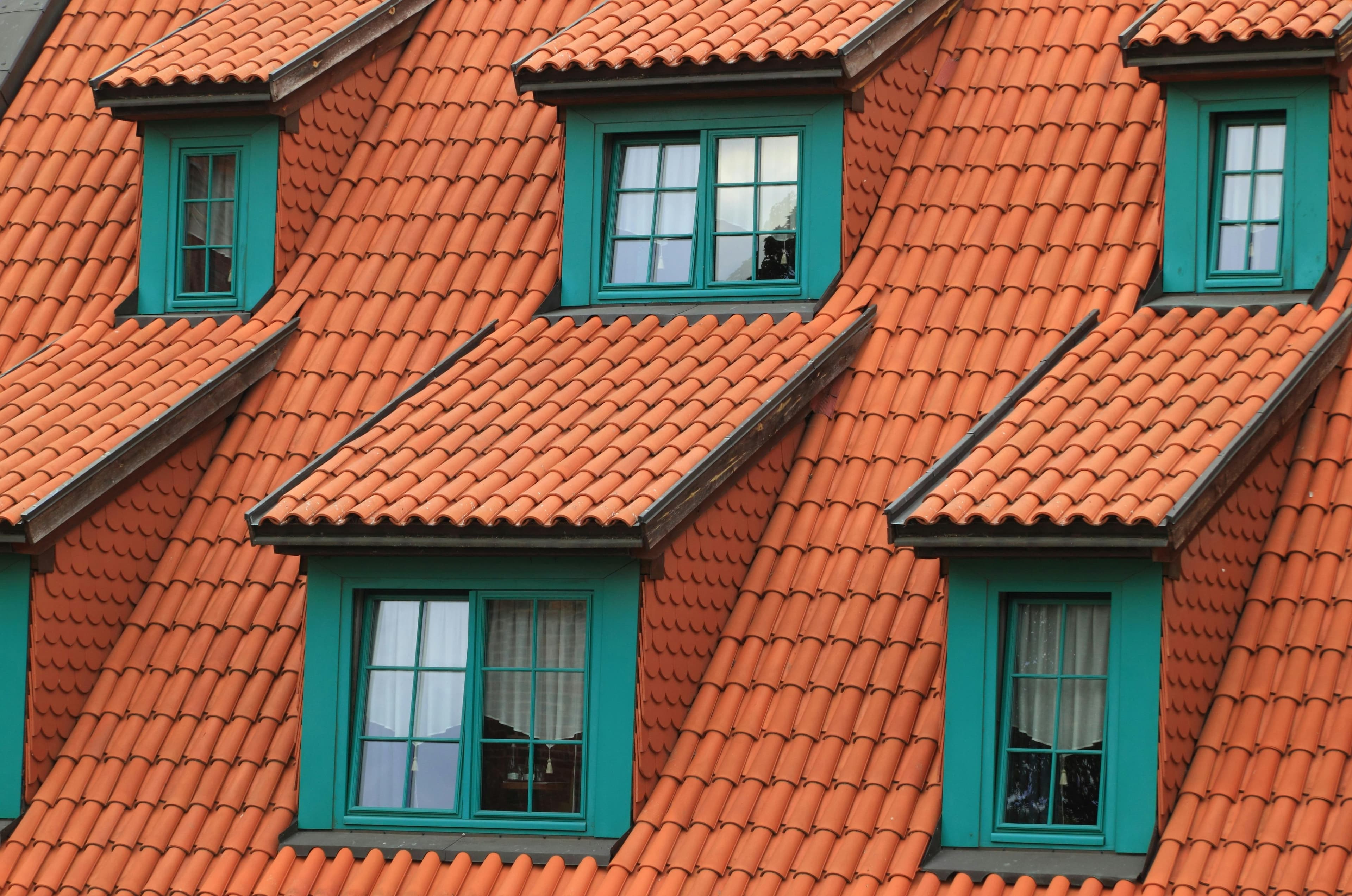 Roofing Team Working on a House